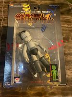 Front view of sealed Astro Boy figure in package