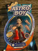 Front view of sealed Bandai Astro Boy Arm Cannon figure in blister card packaging