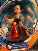 Front close-up of sealed Astro Boy Arm Cannon figure with accessories visible