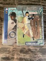 Front of sealed package showing full figure and branding