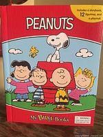 Front cover of Peanuts My Busy Books hardcover showing title and contents note