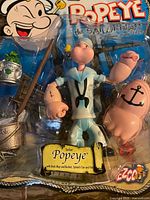 Front close-up of sealed Popeye figure and accessories in blister