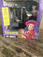 Front of sealed Shrek Duloc Dungeon box showing dungeon playset through window