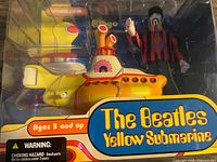 Front view of sealed package showing submarine and figure