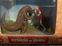 Front view of boxed Bandai Ultraman vs Gomora diorama showing both figures