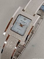 Front view of Jules Jurgensen bracelet watch showing dial