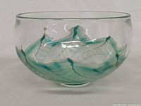 Side view of bowl showing swirl ribbon design