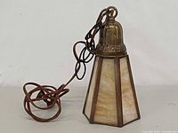 Full view of slag glass pendant with cord