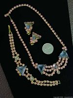 Full set laid out with US quarter for scale