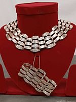 Choker on display bust with bracelet below