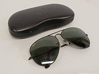 Sunglasses with closed Ray-Ban case
