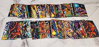 Fronts of assorted Marvel trading cards spread out