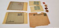 Group view of envelopes, letter sheet, two stamp blocks, five loose stamps