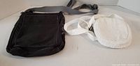 black canvas bag and white sherpa pouch overview