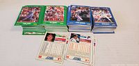 Three stacks of Score baseball cards, green and blue borders, two loose cards front/back