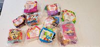 All ten sealed fast-food promotional toys displayed front side
