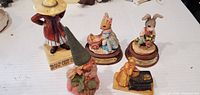Front view of five main resin figurines