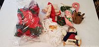 Group of all soft Christmas decor items on table