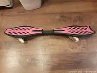 Top view showing pink deck, black edging, leaf pattern