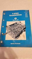 Front cover of Rockwell 9-speed transmission manual showing title, part number PB-8957 and exploded gearbox image