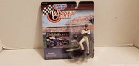 Front view of sealed Dale Earnhardt Starting Lineup Winner's Circle figure package