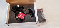 Open box showing Ulanzi clamp, foam insert, ball head, phone holder in plastic bag