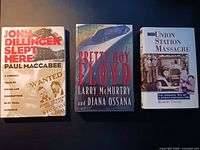 Front covers of all three signed gangster books