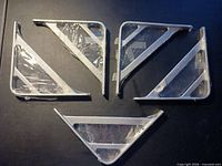 Five cast aluminum shelf brackets arranged; shows overall design and packaging