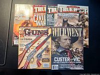 Five of the six western-history magazines displayed: three True West, one Guns of the West, one Wild West