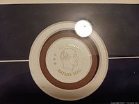 Close-up of A.J. Casson estate seal on lower mat