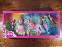 Front view of sealed Barbie Dreamtopia set showing all included figures and accessories