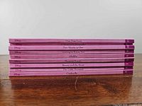 Spines showing nine of the ten hardcover volumes with titles
