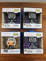 Front view showing four boxed ornaments: three Black Panther, one Ahsoka Tano