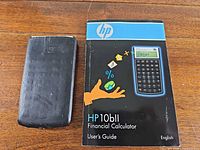 Front view of calculator cover alongside user’s guide