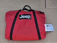 Red Jeep zip bag front view with WARN strap label visible