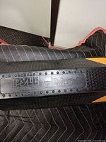 Close-up of Pyle branding and model number on wheel stop