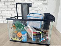 Front view of glass aquarium with accessories inside