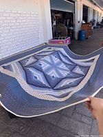 Front view of full quilt laid out showing pattern