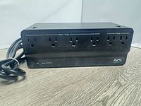 Front view of APC Back-UPS 425 showing six outlets and power cord
