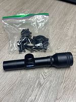 Side view of B-Square riflescope with bag of rings