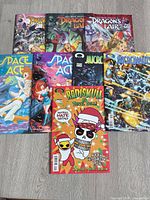 Group shot of all eight comics laid out