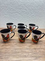 All seven rooster coffee mugs grouped on tabletop