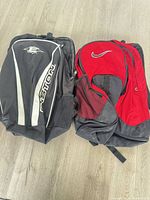 Both backpacks front view on floor