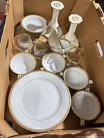 Box view showing assorted Noritake dishes, candlesticks, glass accessories