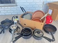 Overall lot showing assorted pots, pans, kettle, baking pan and travel mug