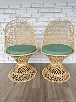 Pair of spun fiberglass pedestal chairs front view