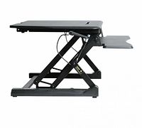 Side profile of assembled black sit-stand desktop converter showing X-frame lift and keyboard tray
