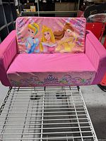 Front view of pink Disney Princess toddler couch-bed