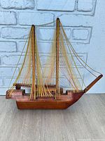 Full view of string art wooden ship model