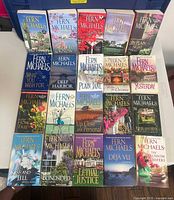 Front view showing all 20 paperback novels laid out in four rows of five